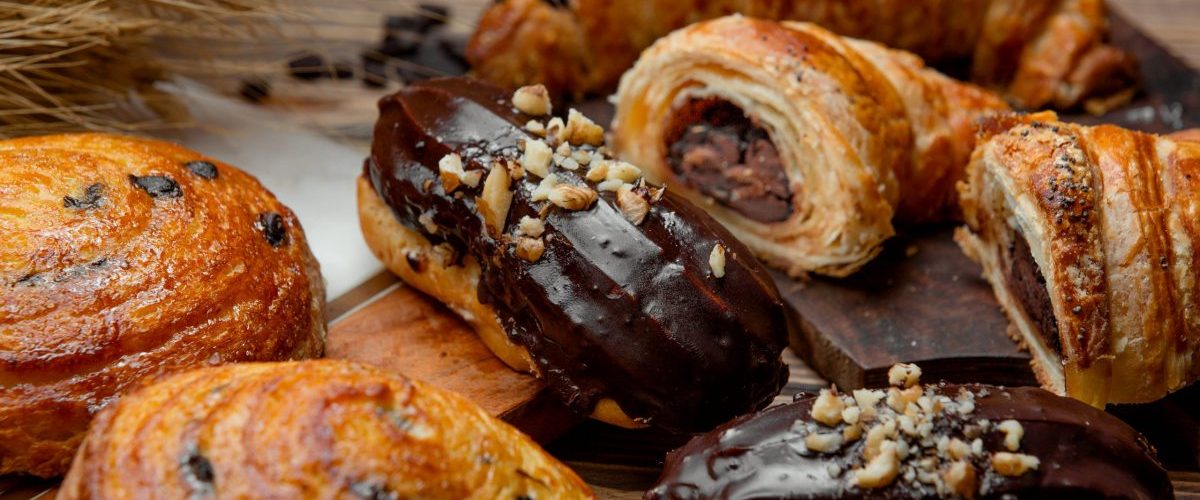 chocolate puff pastry croissant, chocolate eclair and sweet raisin roll